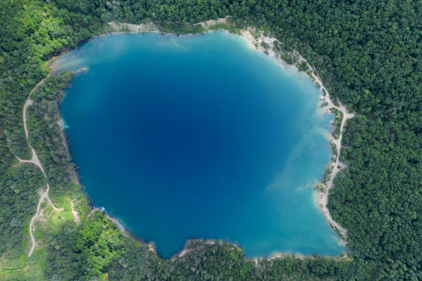 istock Lake in the forest with blue water. 1286538229