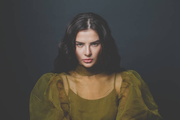 istock Glamorous woman brunette on black background 1286540302