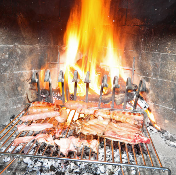 istock large flame in the fireplace while cooking a mixed grill 1286542171