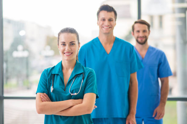 istock Group of doctors standing and looking positive 1286543398