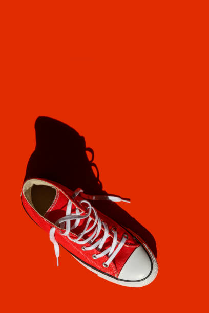 istock Flat lay top view sneakers on red background. 1286543590