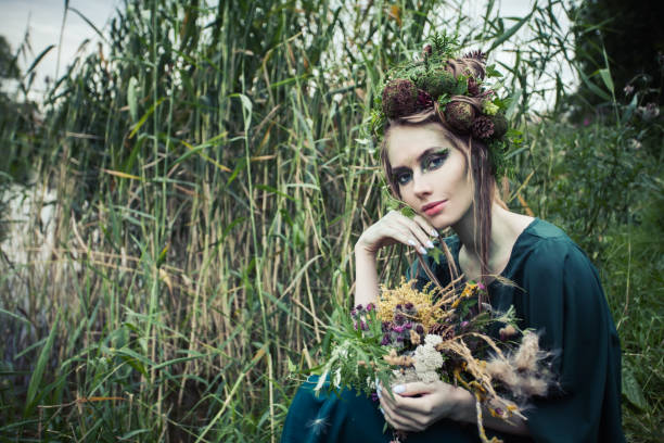 istock Attractive woman on green grass background outdoor 1286543703