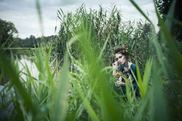 istock Beautiful woman outdoors. Halloween character or Forest soul 1286543736