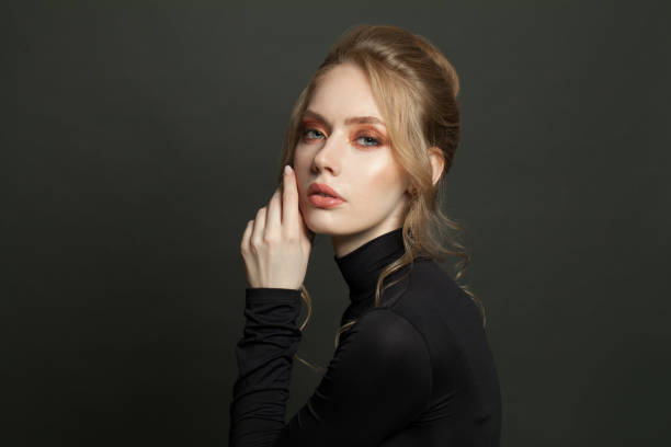 istock Nice woman face on black background 1286544460