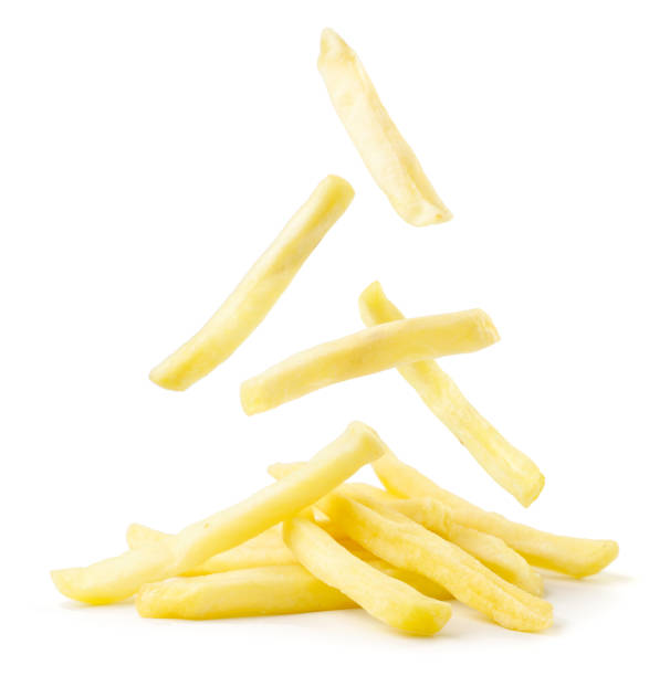 istock French fries falling on a pile close-up on a white. Isolated 1286546368