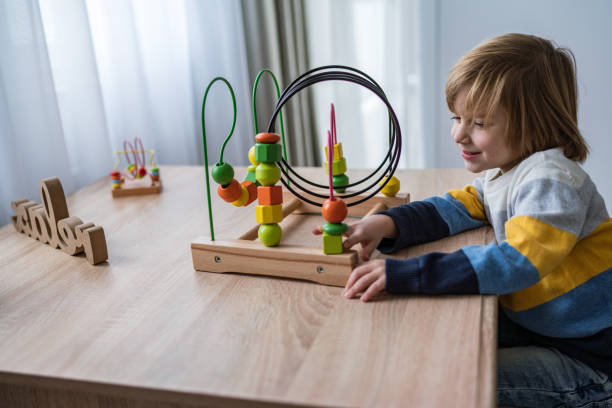 istock Boy with wooden toy 1286546647