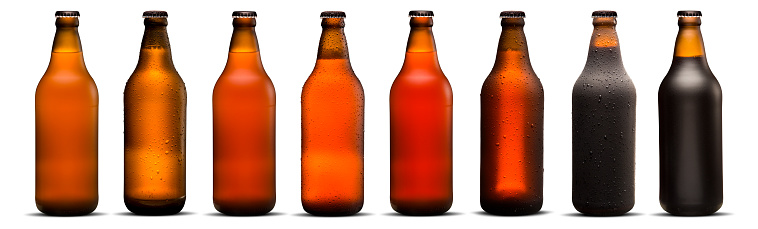 600ml beer bottles with drops and dries on white background. Pilsen, porter, ipa and weiss