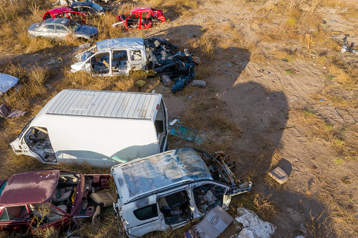 Aerial view of car junkyard. Taken via drone. 4k video.