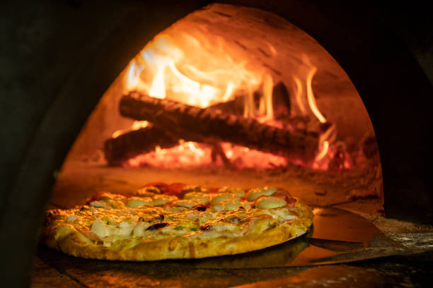 istock Italian pizza inside a wood oven 1286548891