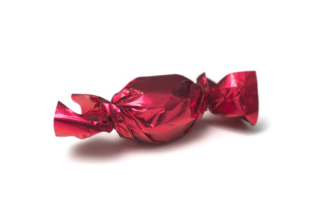 istock chocolate candies in a red paper on white background 1286549652