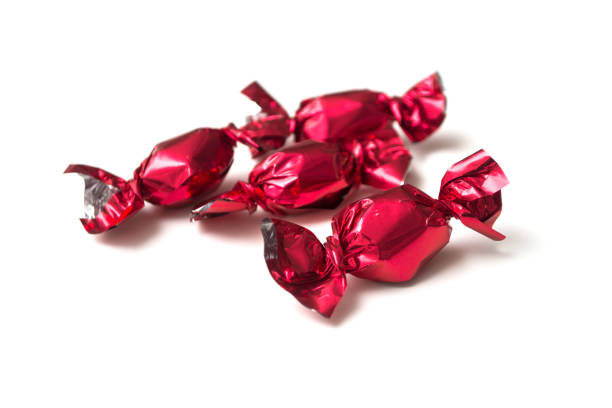 istock chocolate candies in a red paper on white background 1286549654