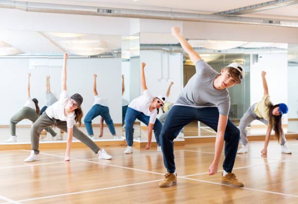 istock Teenagers training hip hop in dance studio 1286549665