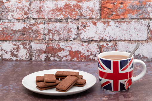 British mug printed with a UK Union Jack flag with some biscuits
