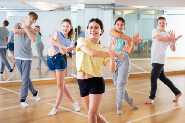 istock Teenage dancers practicing new dance in studio 1286549698
