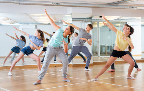 istock Teenage dancers practicing new dance in studio 1286549703