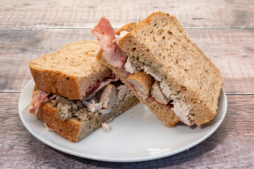 Christmas themed sandwich with turkey, sausage, bacon and stuffing