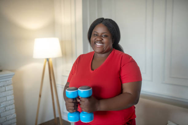 istock Plus size african american woman having a workout with dumbbells 1286552052