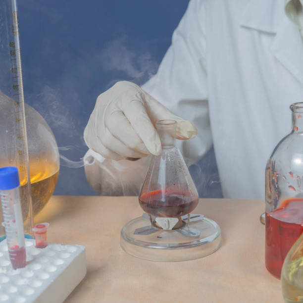 istock Medical technician heats in vitro material for analysis. 1286557140