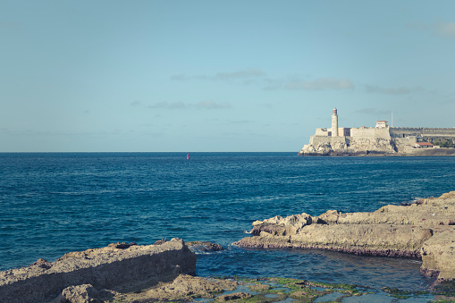 Hercules tower roman lighthouse and Lapas beach in the city of A Coruña in a sunny day, Galicia, Spain.