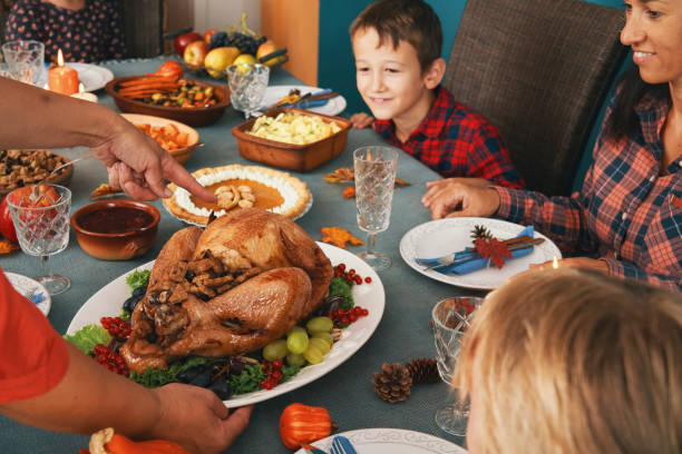 istock Family Having Traditional Holiday Stuffed Turkey Dinner 1286559593