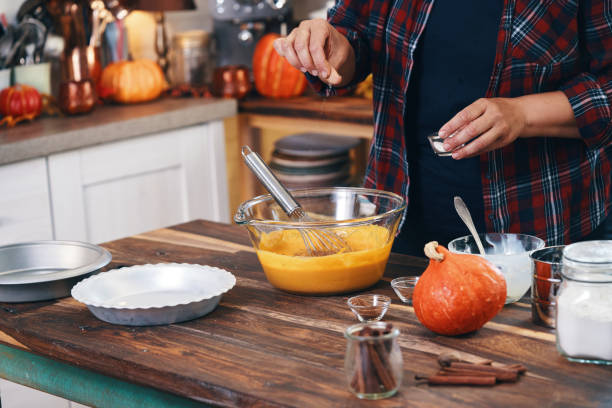 istock Preparing Stuffed Turkey for Holidays in Domestic Kitchen 1286559619