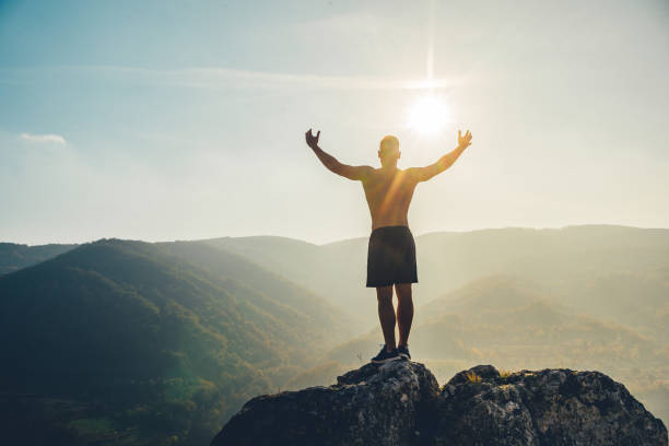 istock Fit man high on mountain 1286559851