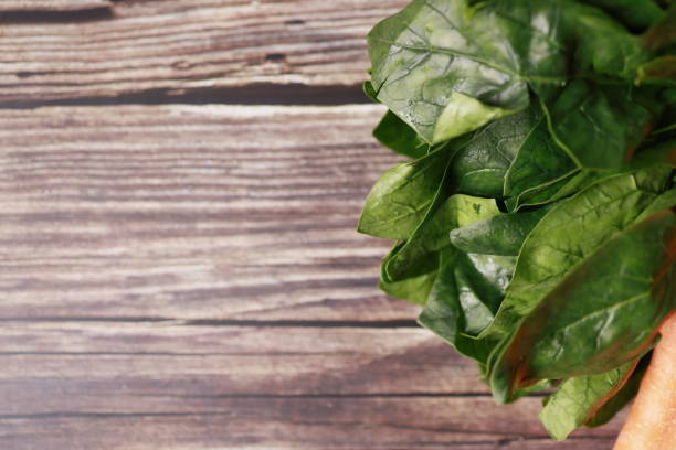 Istanbul, Turkey-November 19, 2020: Spinach on a Wooden Table, Studio Shot, Flat Lay, Full Frame, Istanbul, Turkey.