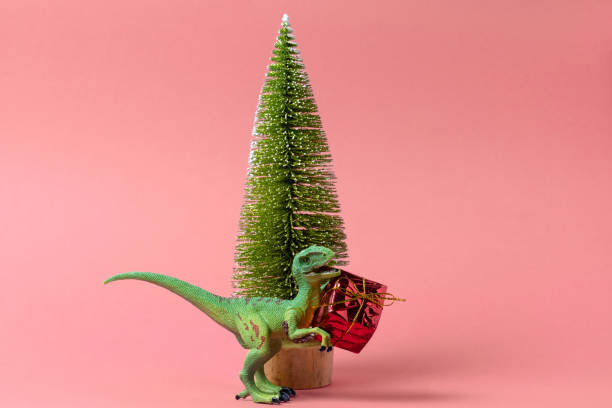 istock minimal greeting card with dinosaur and christmas tree 1286562717
