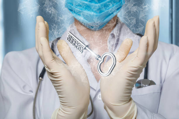 The doctor shows the key to success . The doctor shows the key to success on a blurred background. turnkey project stock pictures, royalty-free photos & images