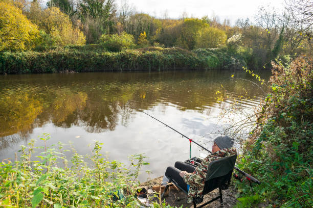 Asian Female Fishing the River Don, Sprotbrough, Doncaster stock photo