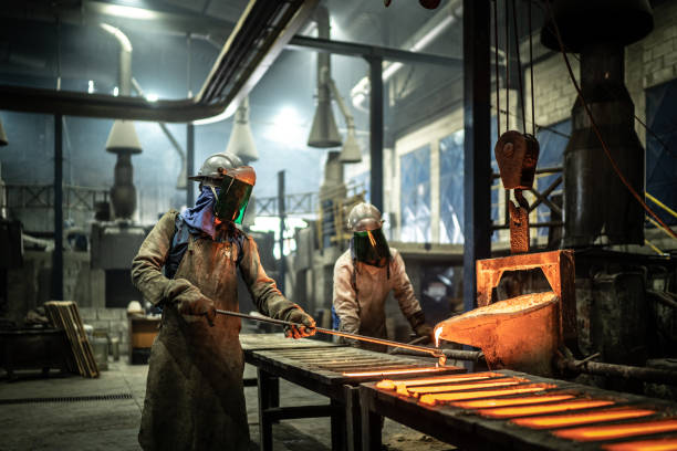 istock Metal industry work - pouring molten metal 1286564308