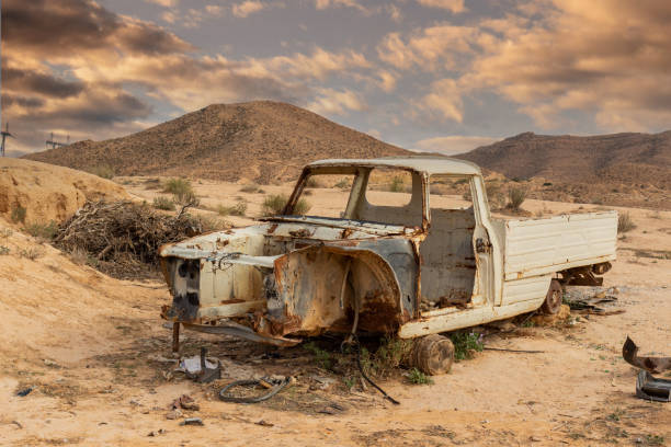 istock Abandoned car is desert, North Africa 1286564918