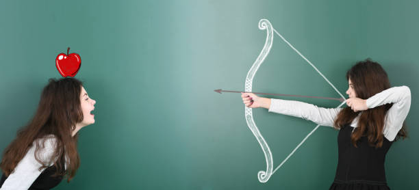 istock Pre-adolescent girl holding painted bow and arrow 1286565682
