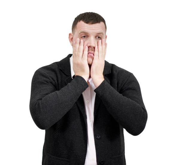 istock Stressed businessman with hands on the face over white background with copy space, sadness and disappointed concept 1286566057
