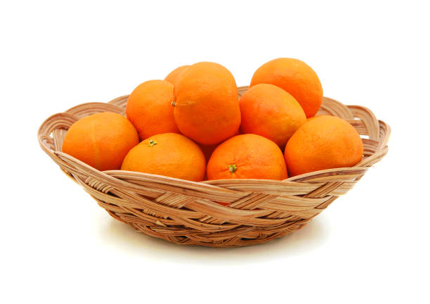 istock tangerines in a beautiful basket isolated on white 1286566524