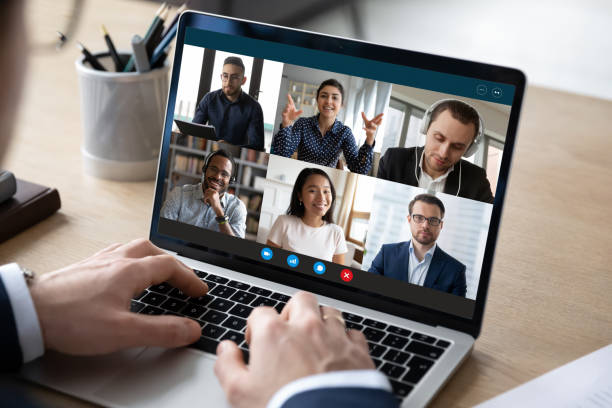 istock Happy multiracial colleagues holding online video conference call. 1286567807