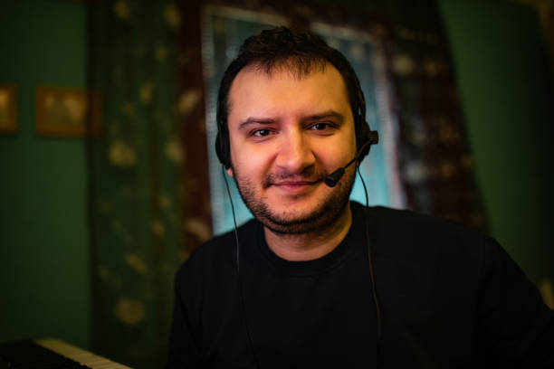 istock Smiling man having a video chat at home 1286567868