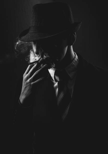 istock Retro man in tie and hat smoking 1286567912