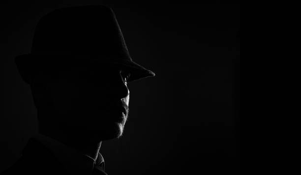 istock Retro man in hat wears suit and tie 1286568916