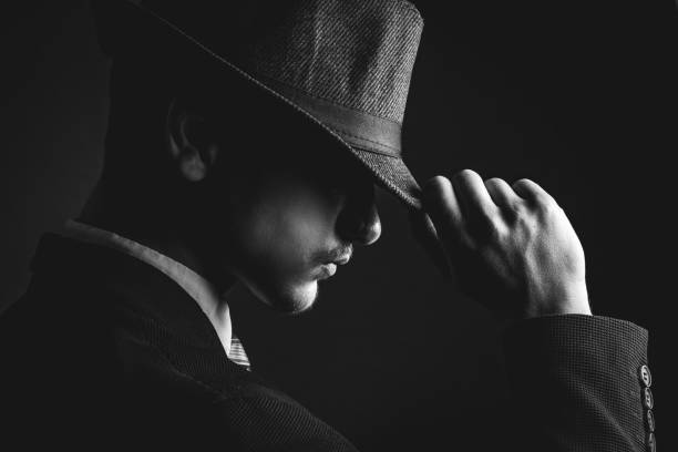 istock Retro man in hat wears suit and tie 1286568941