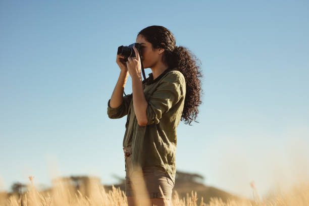 istock Female taking photos outdoors 1286569022