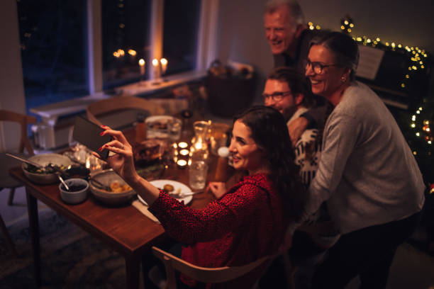 istock Family having a video call during Christmas dinner 1286570721