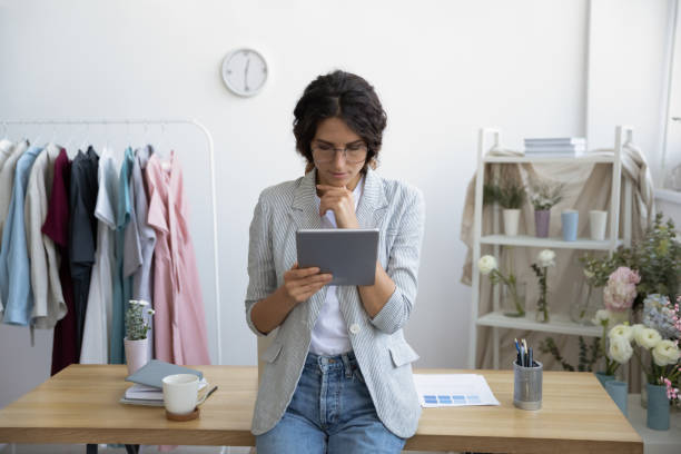 istock Young female fashion designer use tablet in office 1286575903