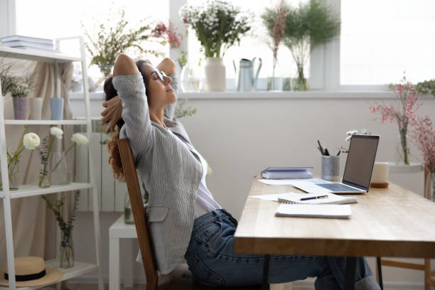 istock Calm female decorator relax in chair at workplace 1286575957