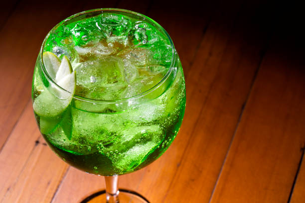 istock Gin and green apple cocktail on wood background 1286576157