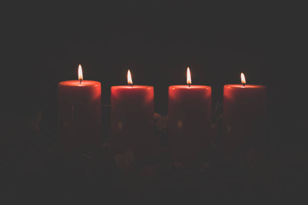 istock Advent candles concept with shining burning candles 1286577666
