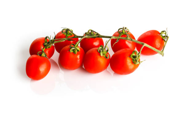Fresh red tomatoe with green leaves stock photo