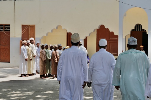 Muslim students in a school in Zanzibar, preparing for prayer.