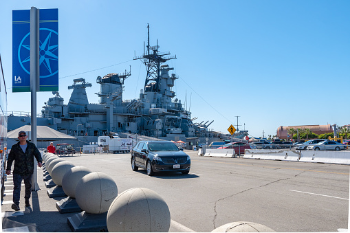 San Pedro, California - October 11 2019: Port of Los Angeles World Cruise Center on the LA Waterfront in San Pedro, California, with the USS Iowa Battleship Museum docked in background.