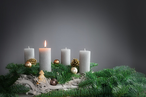 Christmas tree with presents wrapped in cozy living room with fireplace on Christmas Eve